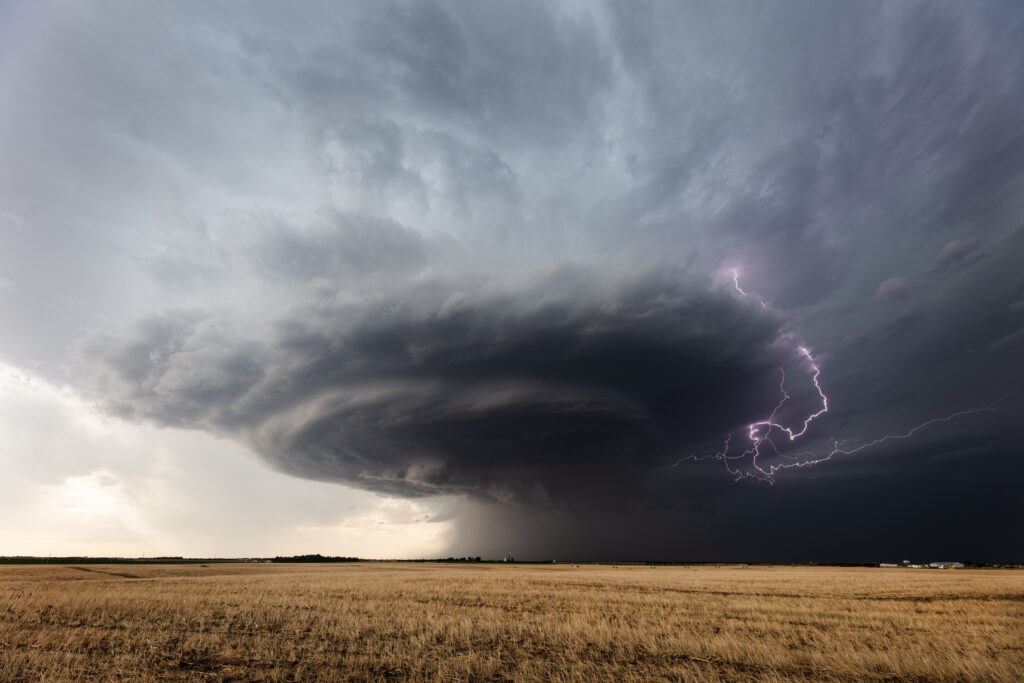 impressive photo of a tornado with lightning in it